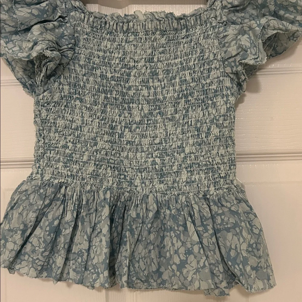Love the Label Anthropologie Blue Flutter Sleeve Smocked Peplum Blouse